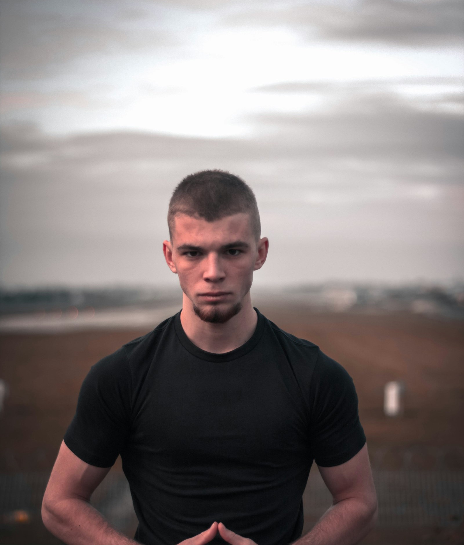 Front of the black heavyweight training tee on an athlete